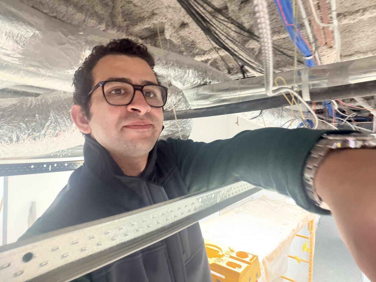 Checking ductwork and HEPA supply above the cleanroom ceiling